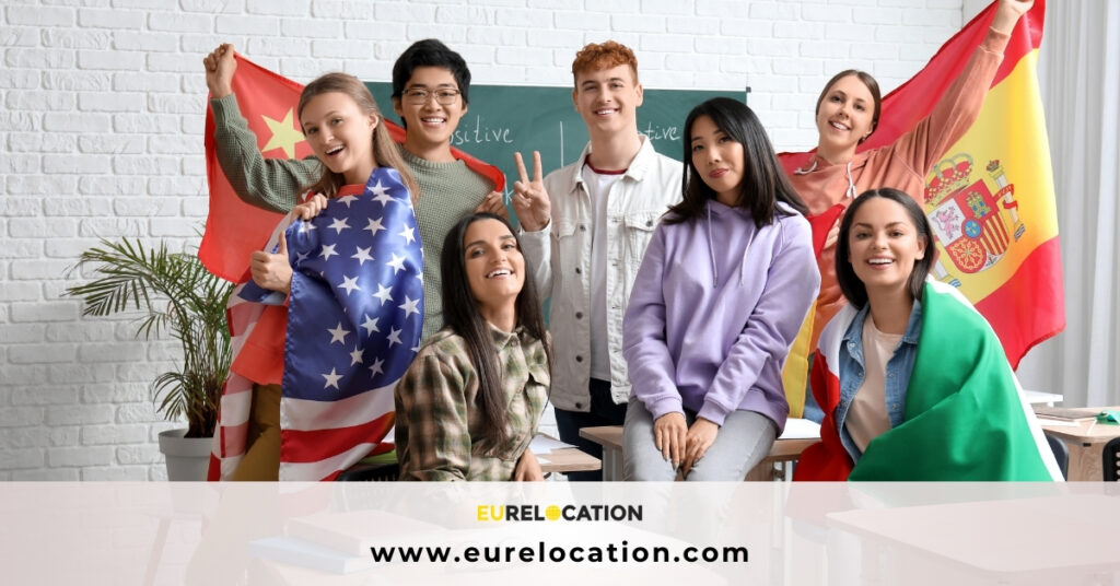 smiling people showing differnt flags